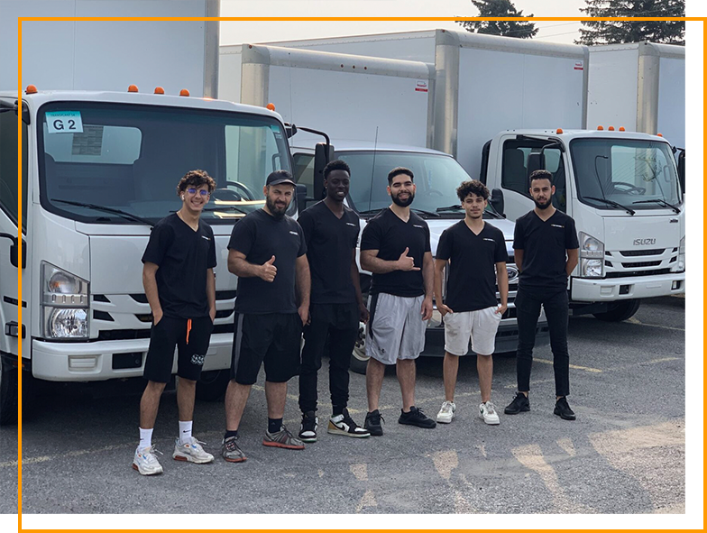 Top Movers MTL commercial movers in Montreal standing in front of moving trucks, ready to provide professional office and business relocation services.