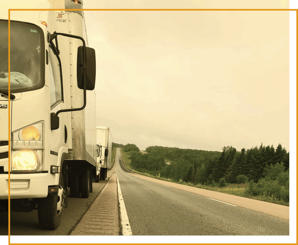 Top Movers Montreal long distance moving truck traveling across Quebec highway
